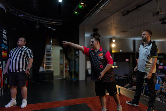 A live darts match on the Throwdown stage